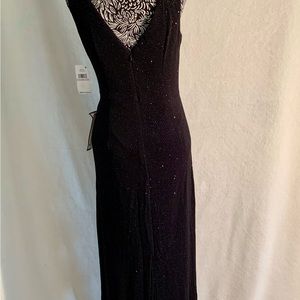 Gorgeous sequenced black evening gown with back slit.
